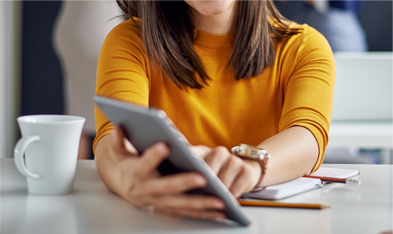 woman holding tablet